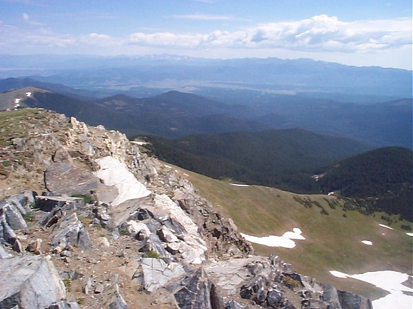Indian Peaks Wilderness (right center), Rocky Mountain National Park (left center), and the town of Fraser in the valley below.