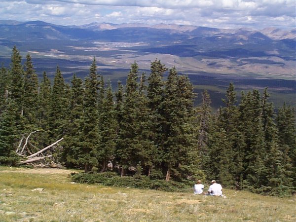 A father and son enjoying the view with Leadville below.