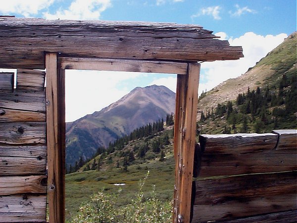 Winfield Peak (13,077 feet) as seen through the ruins of an old mining shack (looking south-southeast).