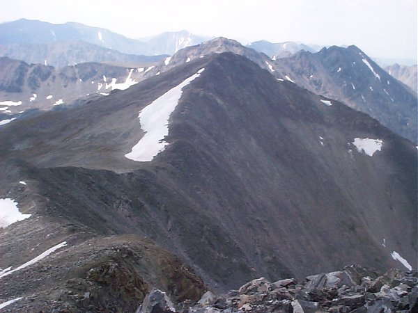 From the top, you can see a summit sometimes called Atlantic Peak just to the south.  The high point mentioned in the previous photo is barely visible on the left hand side of this photo.  On the horizon, (from left to right) are Mount Lincoln, Mount Cameron, and Mount Democrat.
