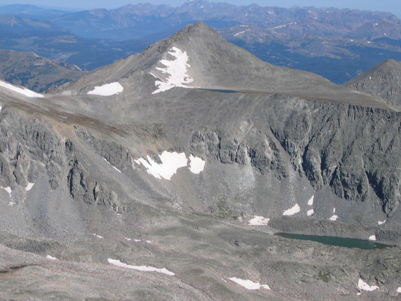 That is Pacific Peak just to the northwest.  Notice the small, unnamed lake just below its' summit behind the ridge.  The unnamed lake prominent in this image sits at an elevation of 12,695 feet.