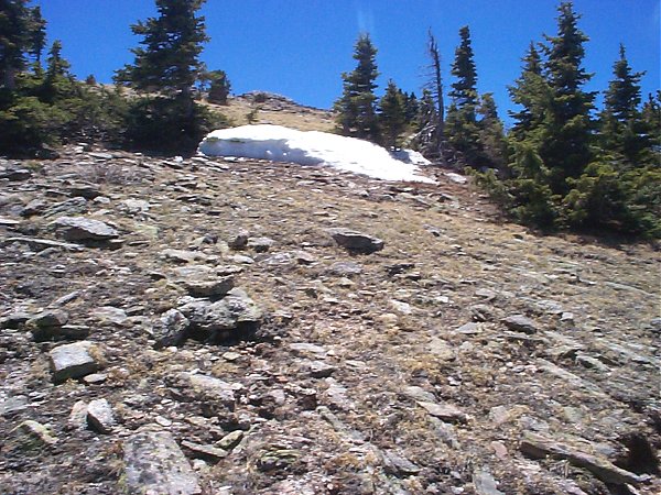 That's the top up there.  It may look steep but the trail slopes gently across the face of the mountain.