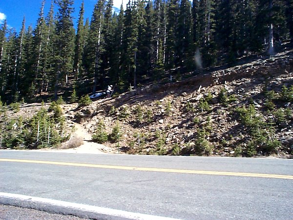 Tommy starts out the hike from the unmarked trailhead along the road.