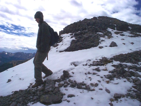 Terese coming over the top of the summit of the no named (?) sub-peak.  The snow was new the day before our hike.