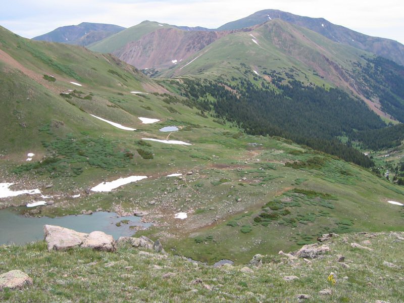 Looking east, one can easily see from left to right, Bard Peak, Woods Mountain, and Mount Parnassus behind Mount Machebeuf.