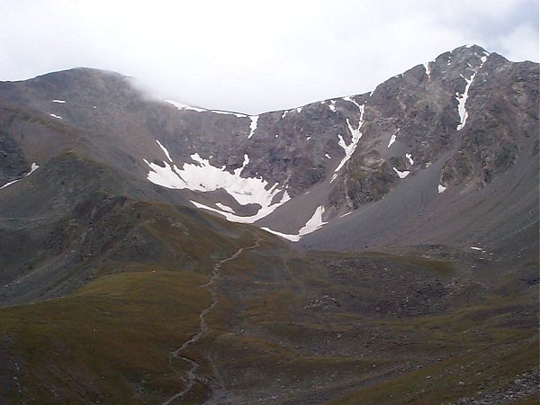 Clouds threaten the summit of Grays and Torreys Peaks with the trail to Grays and Torreys clearly visible in the center of the photo.