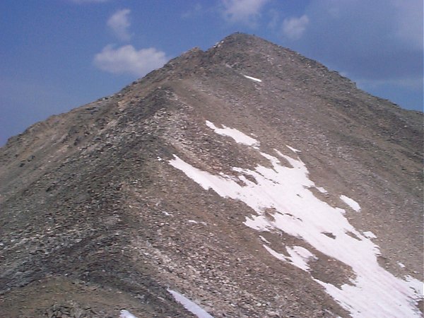 Above the saddle there's a high spot at about 13,560 feet which provides a good view directly north to the face of Pacific Peak.  From here it's a direct push three tenths of a mile and 430 feet to the top.