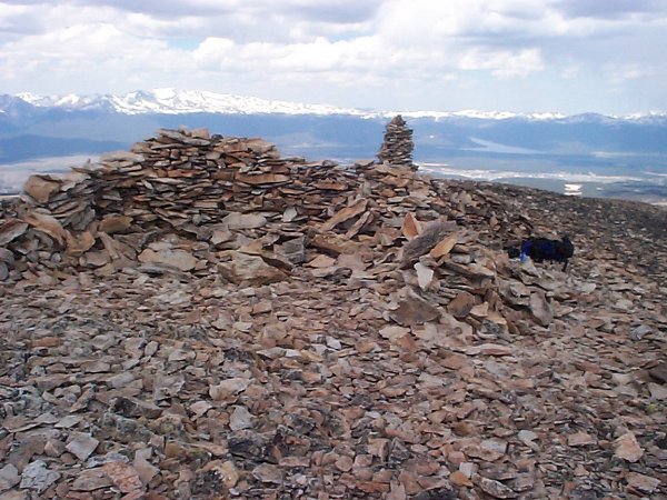 Only a few feet lower than the actual summit, on the west side of the top of the mountain there exists stone structure which I used to block the wind.