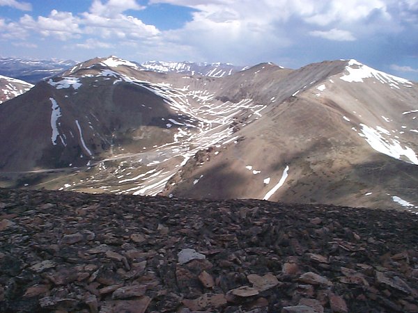 A view of Iowa Amphitheater to the north-northeast which contains the currently closed Continental Chief Mine.  Surrounding the Amphitheater (from left to right) are Dyer Mountain (13,855 feet), Gemini Peak (13,981 feet) and Mount Sherman (14,036 feet).