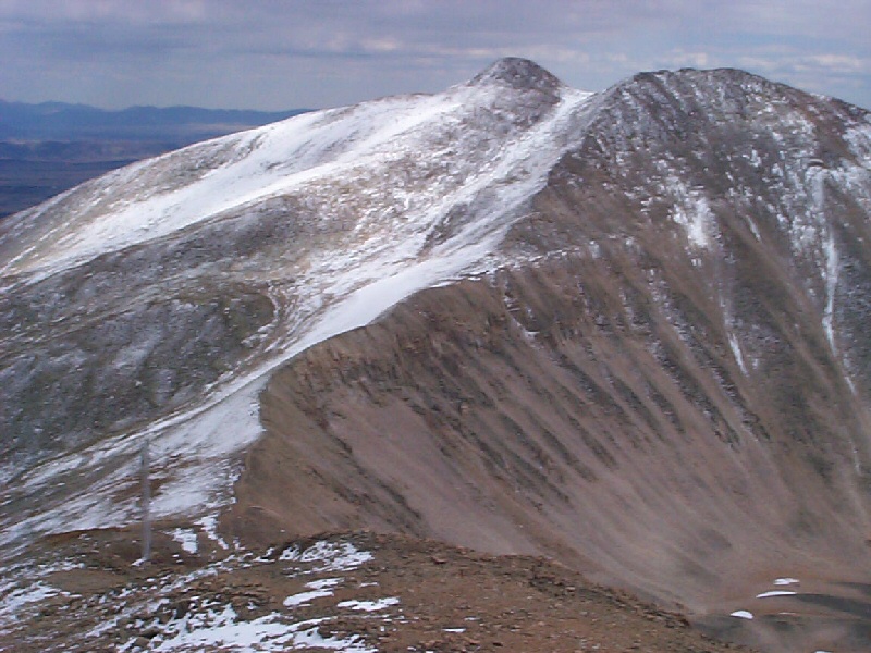 From the summit of Dyer Mountain, I had a good view of Gemini Peak (looking east-southeast).  In the larger image you can make out in the saddle a blur which is actually a tower for high power transmission lines.