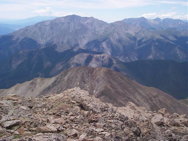 From left to right, Mount Princeton (14,197 feet) dominates the view to the south-southwest while Mount Antero (14,269 feet) and Mount Shavano (14,229 feet) make up the other two distant high points in this photo.