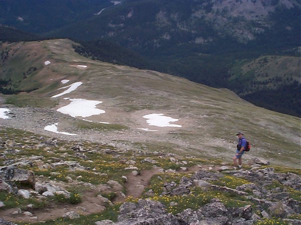 On the way back down, another hiker adds perspective to the trail as it rises through the meadow between 12,750 and 13,500 feet.