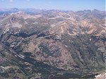 Averaging three miles to the west, you can see a long section of the Continental Divide and several shorter peaks including Granite Mountain and another Grizzly Peak.