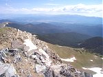 Indian Peaks Wilderness (right center), Rocky Mountain National Park (left center), and the town of Fraser in the valley below.