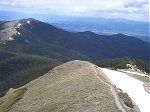 A view of the trail as it follows the ridge back down.  [Note: if you click through to the larger image you may be able to notice the road to the trailhead hidden in the trees just to the left of the knob near the middle of the image.]