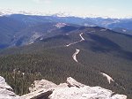 Below you Squaw Pass Road is visible winding along the ridge headed West.