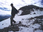 Terese coming over the top of the summit of the no named (?) sub-peak.  The snow was new the day before our hike.