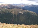 Baker Mountain (12,488 feet) looks like a ridge when seen in front of Mount Sniktau (13,234 feet).  Visible beyond that (from right to left) is Mount Parnassus, Woods Mountain (12,940 feet), Mount Bethel, Pettingell Peak, Hag Peak (13,294 ft. - Citadel Peak?), and Hager Mountain.