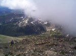 Hikers trying to beat the clouds to the summit.