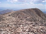 Although I had already walked past this, the actual summit of Mount Sheridan (13,748 feet), here's what it looks like when facing east with South Park as the background.