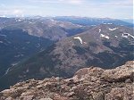There's a Whistle Pig (Yellow Bellied Marmot) posing in the foreground of this photo taken from the summit looking southwest.